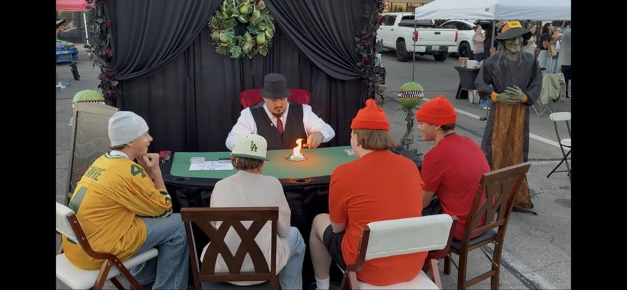 The Wizard reading a guest at a candle-lit table